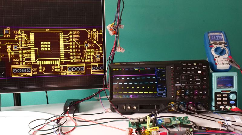 Electronics workbench with circuit board and oscilloscope